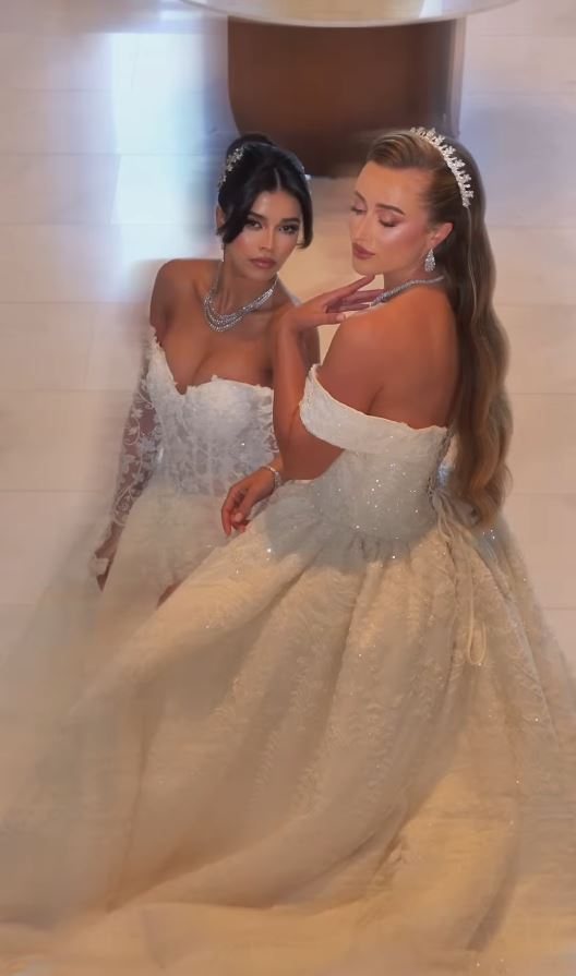 Two brides photographed together at the salon