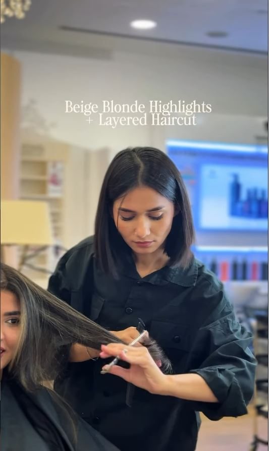 Beige blonde highlights being sectioned